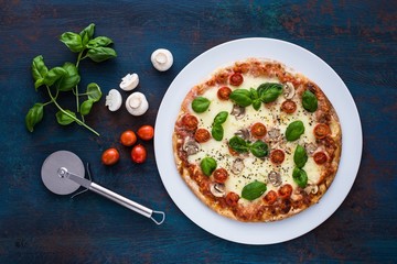 Wall Mural - Pizza with mushrooms, tomatoes and basil