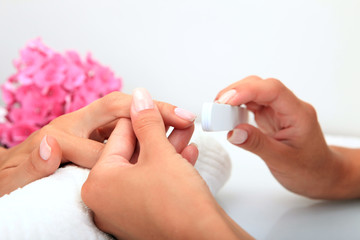 Sticker - Woman in a nail salon receiving a manicure