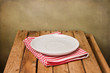 Background with empty plate and wooden table