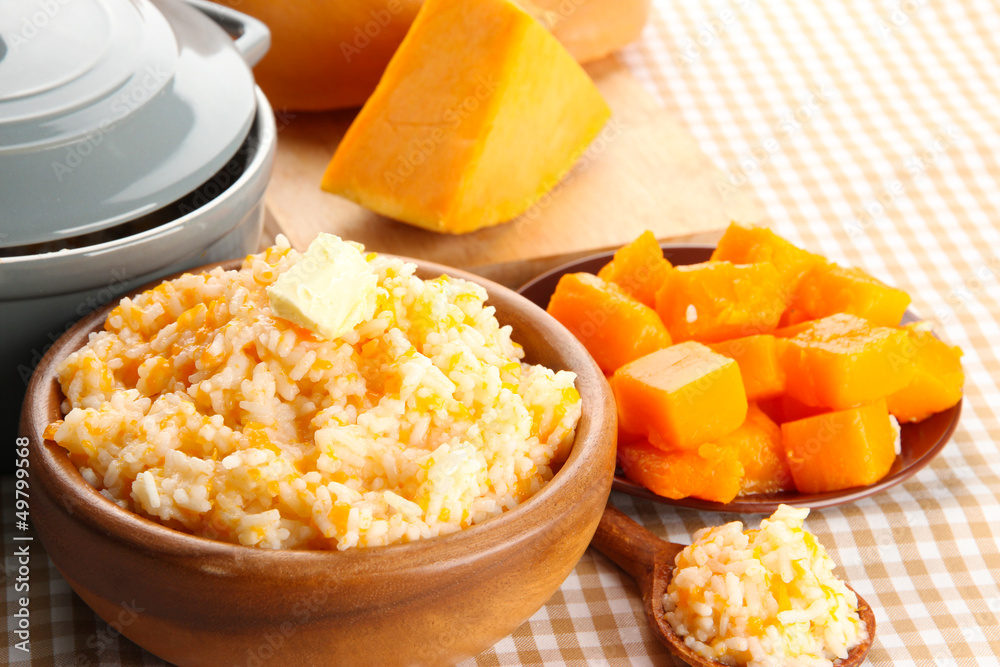 Taste rice porridge with pumpkin in bowl