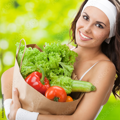 Nowoczesny obraz na płótnie Woman in fitness wear with vegetarian food