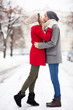 © pikselstock - Young couple kissing on winter day