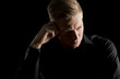© lichtmeister - Low key portrait of handsome man looking aside.