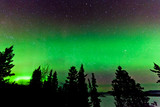 Fototapeta  - Green glow of Northern Lights or Aurora borealis