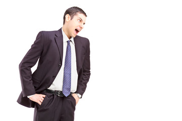 Wall Mural - Angry young man in a suit shouting