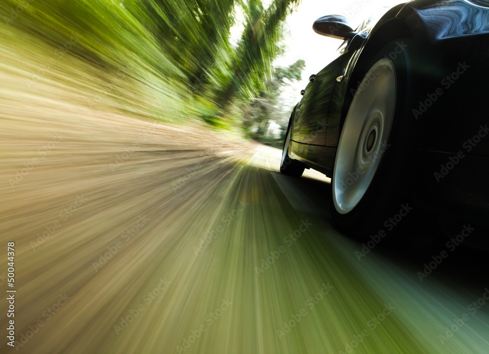Foto-Doppelrollo - Side view of black car with heavy blurred motion.