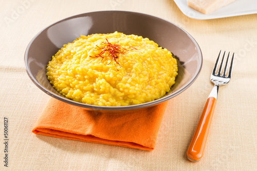 Fotomural Risotto alla milanese - Saffron rice, closeup