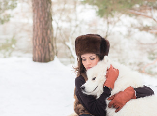 girl with samoed dog