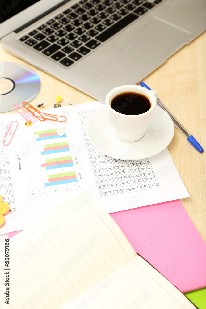 Cup of coffee on office desktop close-up