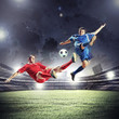 © Sergey Nivens - two football players striking the ball