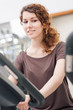 © pio3 - Young woman training in the gym with bike.