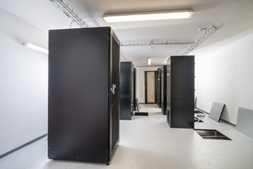 Poster - server cabinets inside data center room