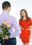 Fototapeta  - Young happy couple with pink roses