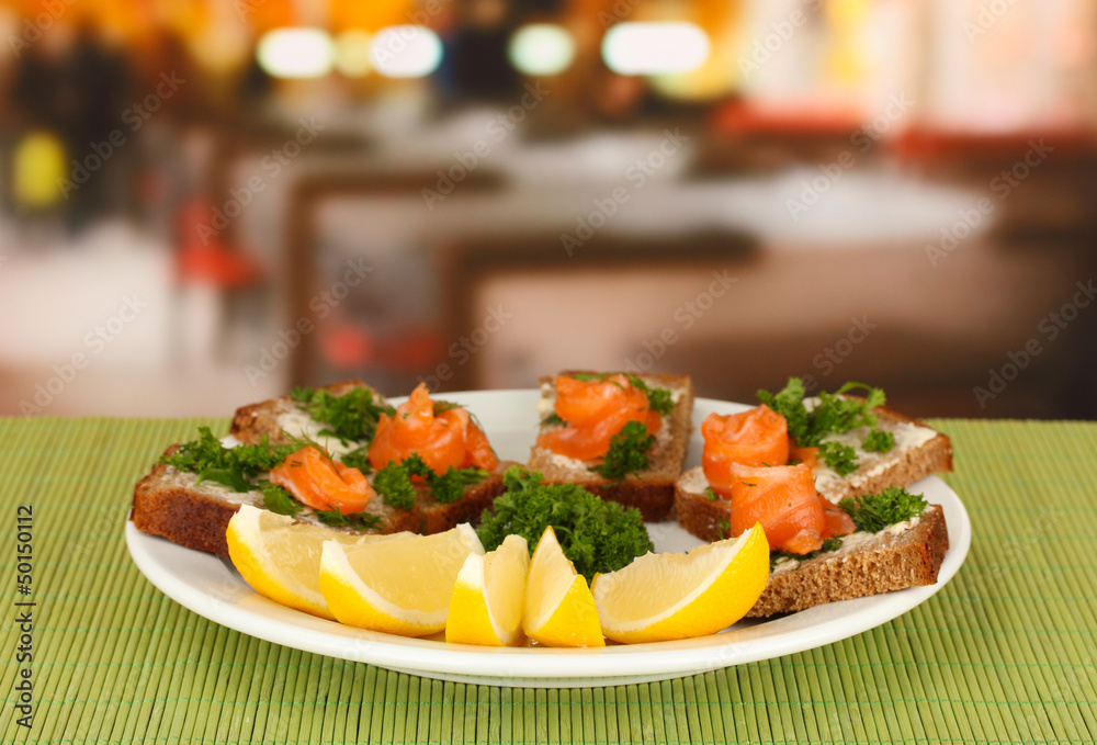 Salmon sandwich on plate,on bright background