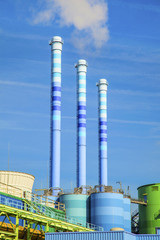 blue chimney in industry plant with smoke