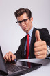 © Viorel Sima - man at laptop, showing thumbs up