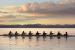 © Pete Saloutos/Blend Images - Team rowing boat in bay
