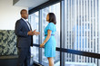 © Inti St Clair/Blend Images - African American business people talking in office lobby