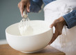 © JGI/Jamie Grill/Blend Images - Cape Verdean woman whisking cream