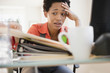 © JGI/Jamie Grill/Blend Images - Frustrated African American woman sitting at desk