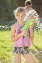Caucasian Girl Holding A Water Gun