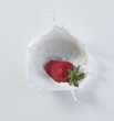 © Walter Zerla/Blend Images - Strawberry dropping into milk