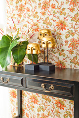 Side table with flowers and interior decoration