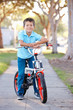 Boy Riding Bike On Path
