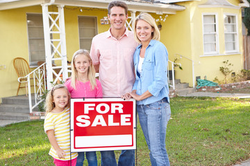 Wall Mural - Family Standing By For Sale Sign Outside Home