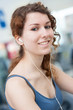 © pio3 - Young woman portrait in the gym while listening to music.