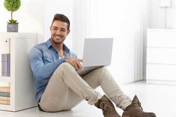 Happy man with laptop