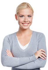 Portrait of woman with arms crossed, isolated on white