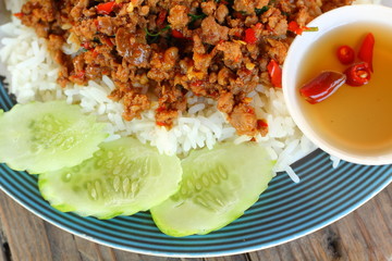 Sticker - Rice topped with fried pork and basil