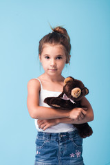 Wall Mural - cute little girl on blue background