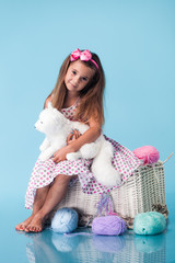 Wall Mural - cute little girl on blue background