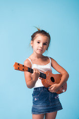 Wall Mural - cute little girl on blue background