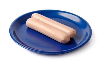 two sausages on a blue plate. isolated on white, clipping path