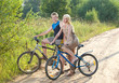 © Konstantin Kulikov - The guy and the girl by bicycles on the rural road
