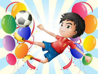 Canvas Print - A soccer player with balloons