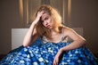 © listercz - young caucasian woman in bed with headache and hangover