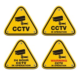 Wall Mural - CCTV in operation - yellow sign