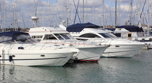 Naklejka na kafelki Luxury boats moored at a marina