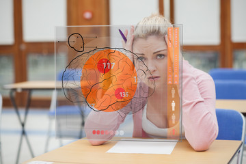 Poster - Blonde woman thinking hard while studying on interface with brai