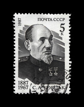 Sidor Kovpak, Soviet Military Commander, Partisan, USSR, Circa 1987. Vintage Postal Stamp Isolated On Black Background.