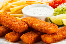 Fried Fish Fingers, French Fries And Vegetables
