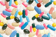 Pill and colorful medical capsule texture background