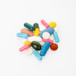 Pill and colorful medical capsule heap, clipping path