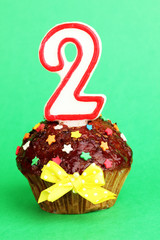 Poster - Birthday cupcake with chocolate frosting on background