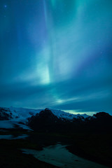 Wall Mural - northern lights above lagoon in iceland