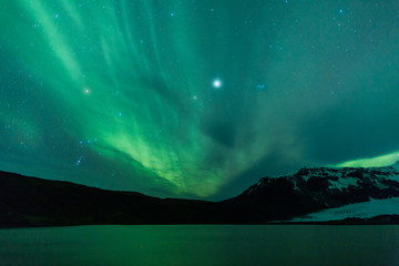 Wall Mural - northern lights above lagoon in iceland